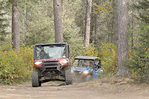 ATVs on a wooded Prospector trail